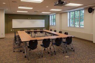 Bousfield multi purpose room with conference tables, chairs, white board